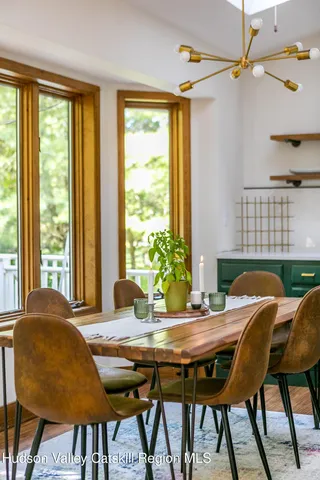 a view of a dining room with furniture and window