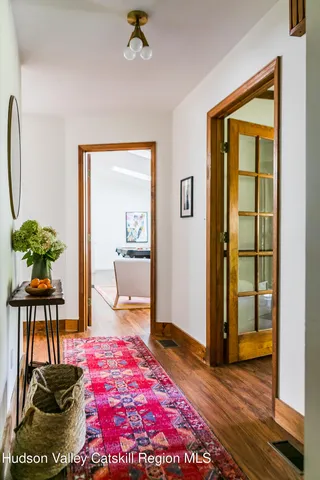 a bedroom with a bed and a potted plant