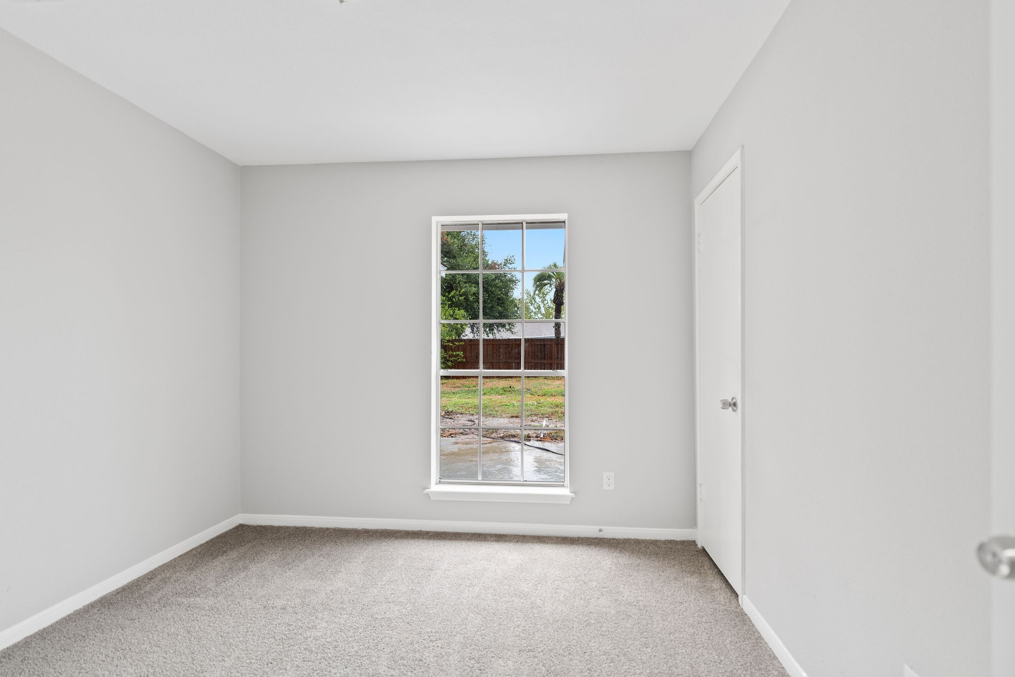 125 Bastrop Street Angleton, TX 77515 - Photo 13 of 18 an empty room with windows