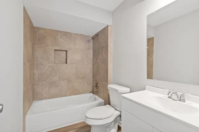 a bathroom with a sink a toilet and a bathtub