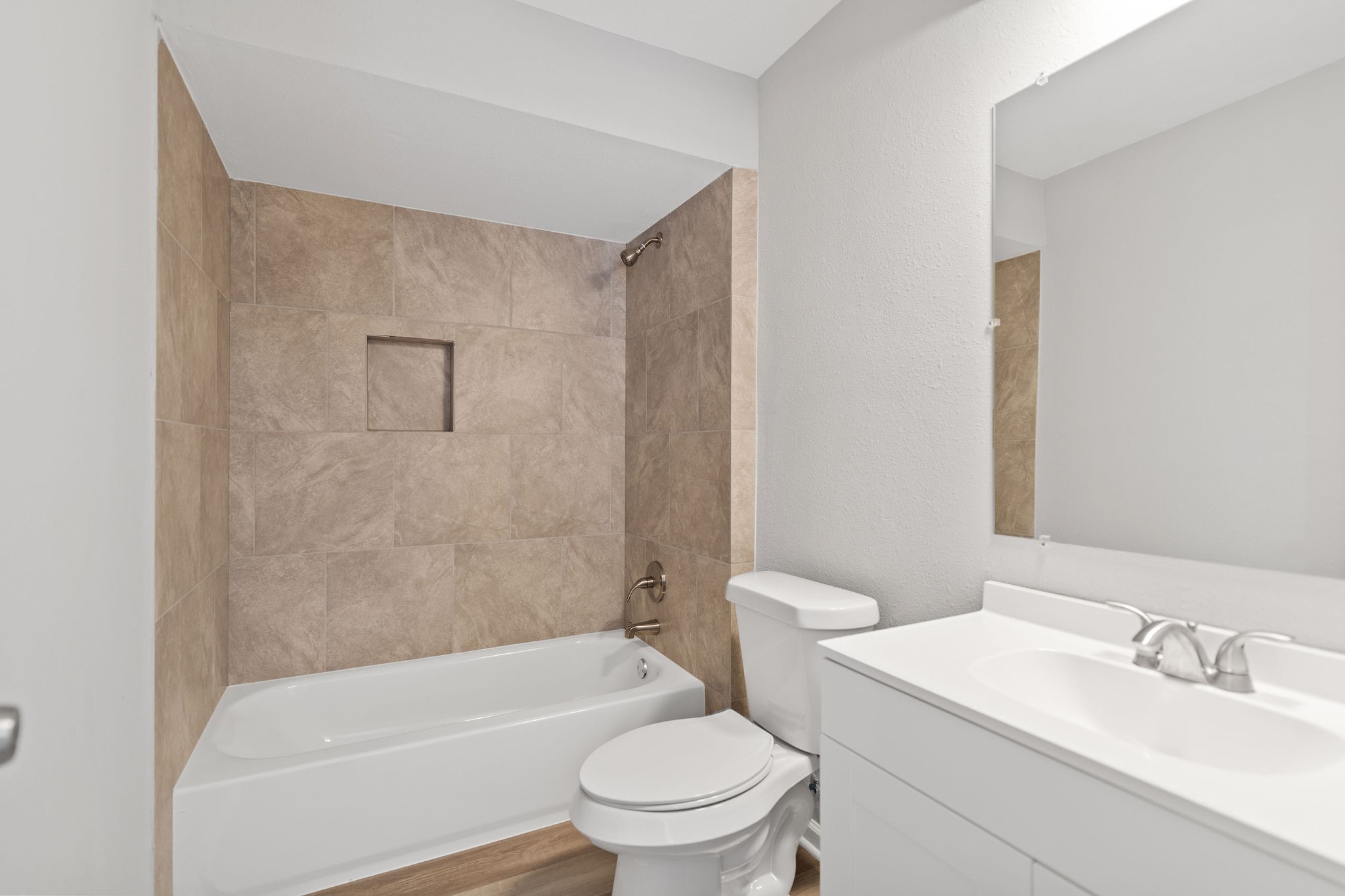 125 Bastrop Street Angleton, TX 77515 - Photo 14 of 18 a bathroom with a sink a toilet and a bathtub