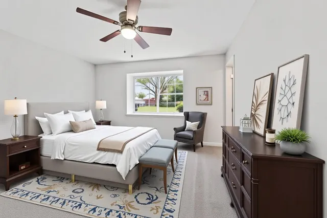 a bedroom with a bed furniture and a window