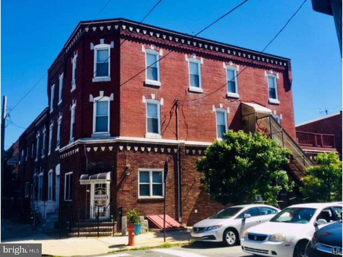 2349 South 11th Street, Unit 2 Philadelphia, PA 19148 - Photo 1 of 8 a front view of a building and car parked