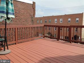 2349 South 11th Street, Unit 2 Philadelphia, PA 19148 - Photo 8 of 8 a terrace of a house with wooden floor