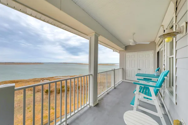 a view of two chairs in balcony