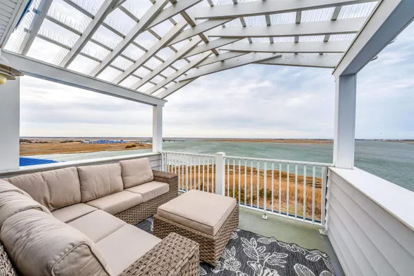 a balcony with furniture and city view