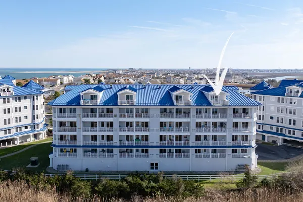 a view of a large building with a view of a lake
