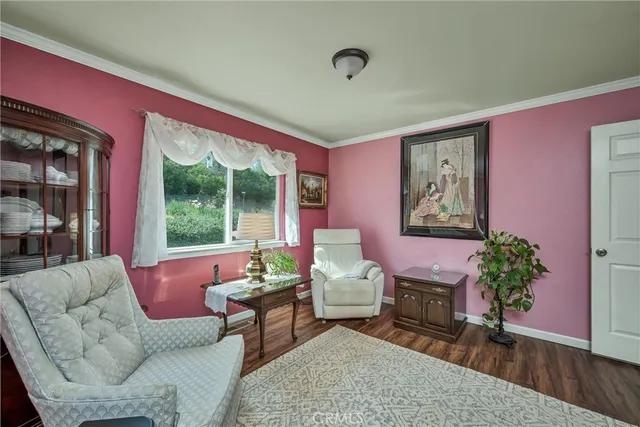 a bed sitting in a room next to a window