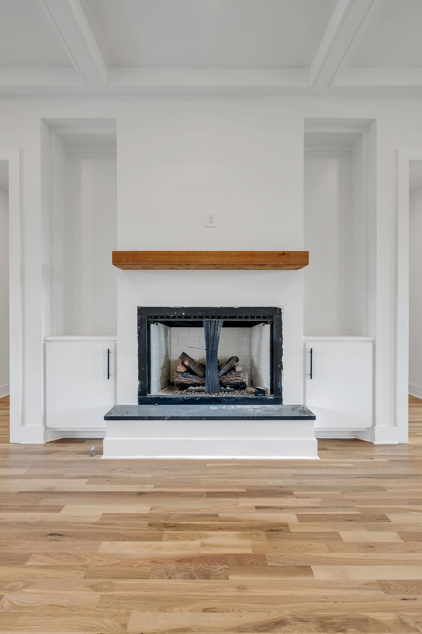 1146 Maxwell Branch Road Cottontown, TN 37048 - Photo 10 of 41 a living room with a fireplace and a wooden floor