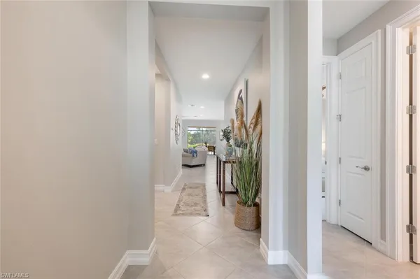 a view of a hallway and a dining room