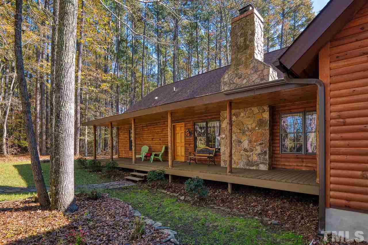 736 Highland Road Apex, NC 27523 - Photo 3 of 25 Long front porch with field stone chimney.