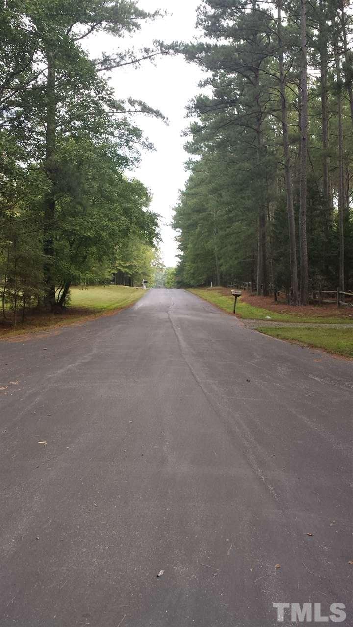 736 Highland Road Apex, NC 27523 - Photo 22 of 25 When leaving and driving out of the cul-de-sac, this picture shows the view going up the private road.