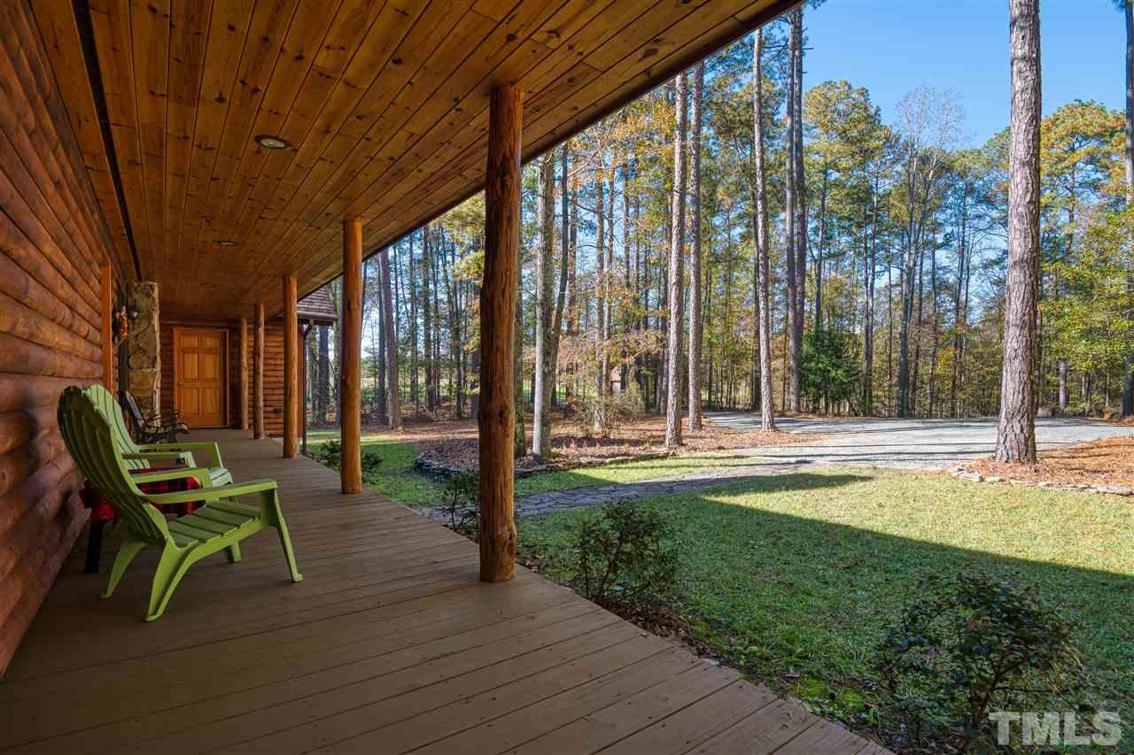 736 Highland Road Apex, NC 27523 - Photo 4 of 25 Relax and stay out of the summer sun on a north facing front porch.