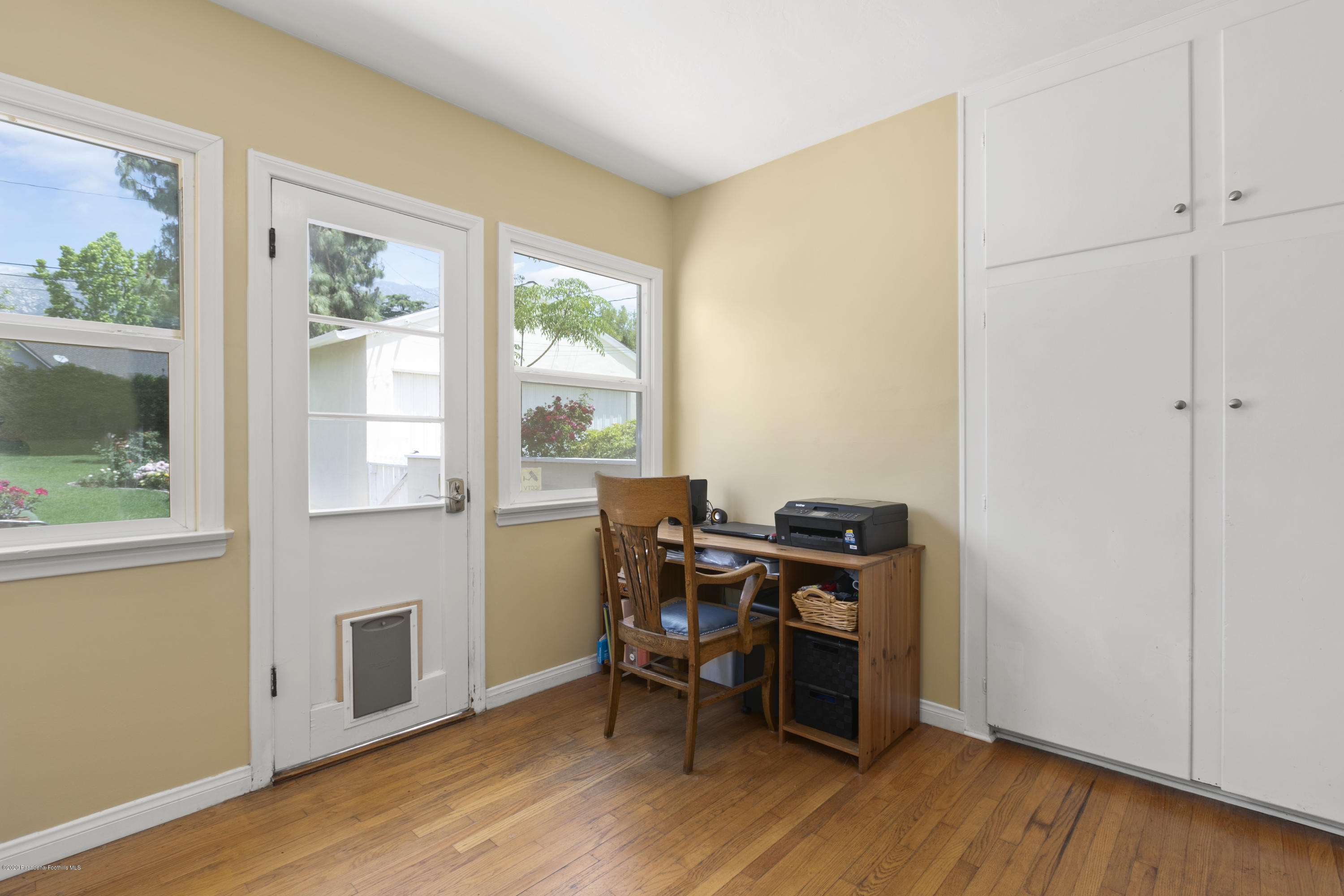 1231 Meadowbrook Road Altadena, CA 91001 - Photo 20 of 25 a view of a workspace with furniture and a window