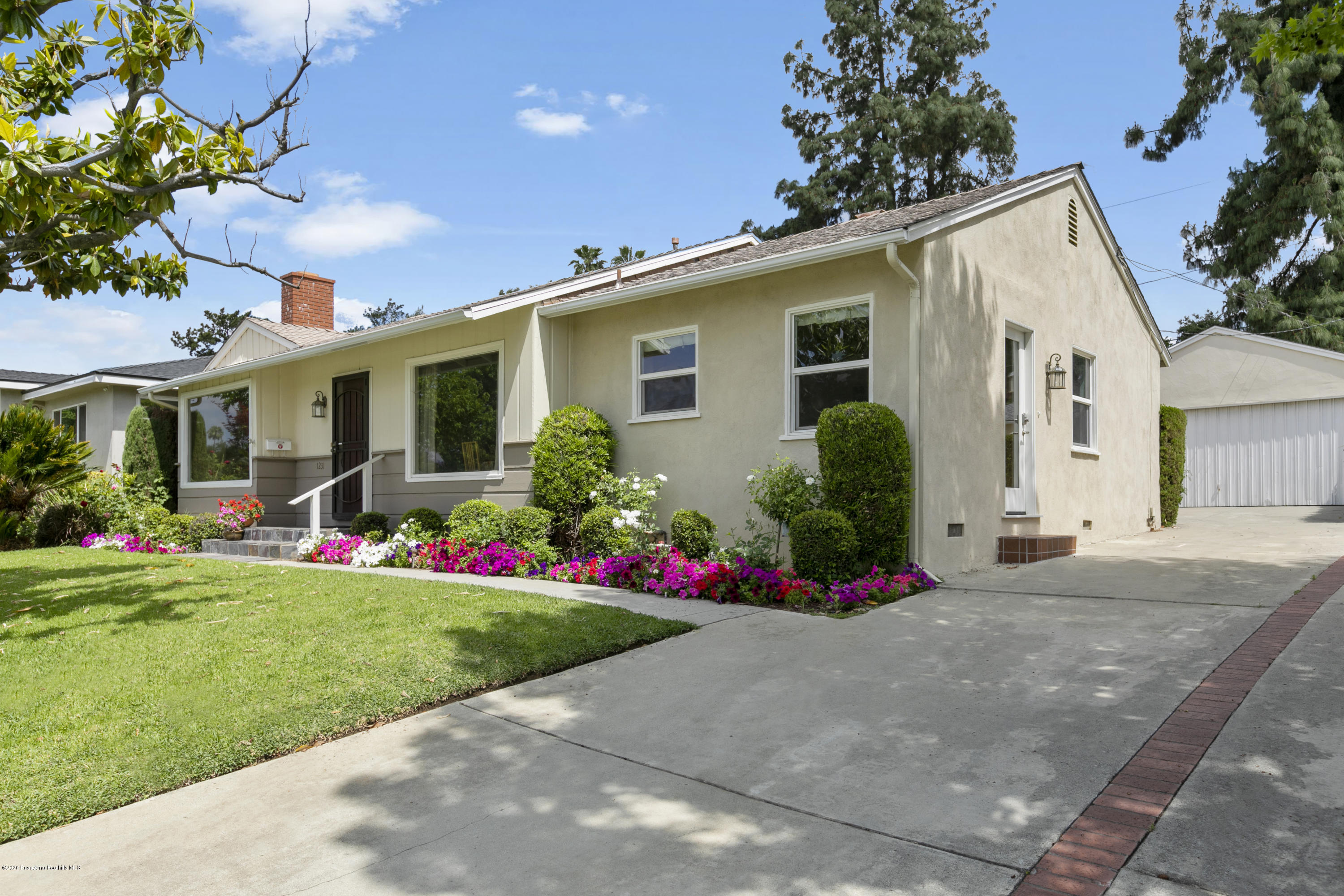 1231 Meadowbrook Road Altadena, CA 91001 - Photo 3 of 25 a front view of house with yard and green space