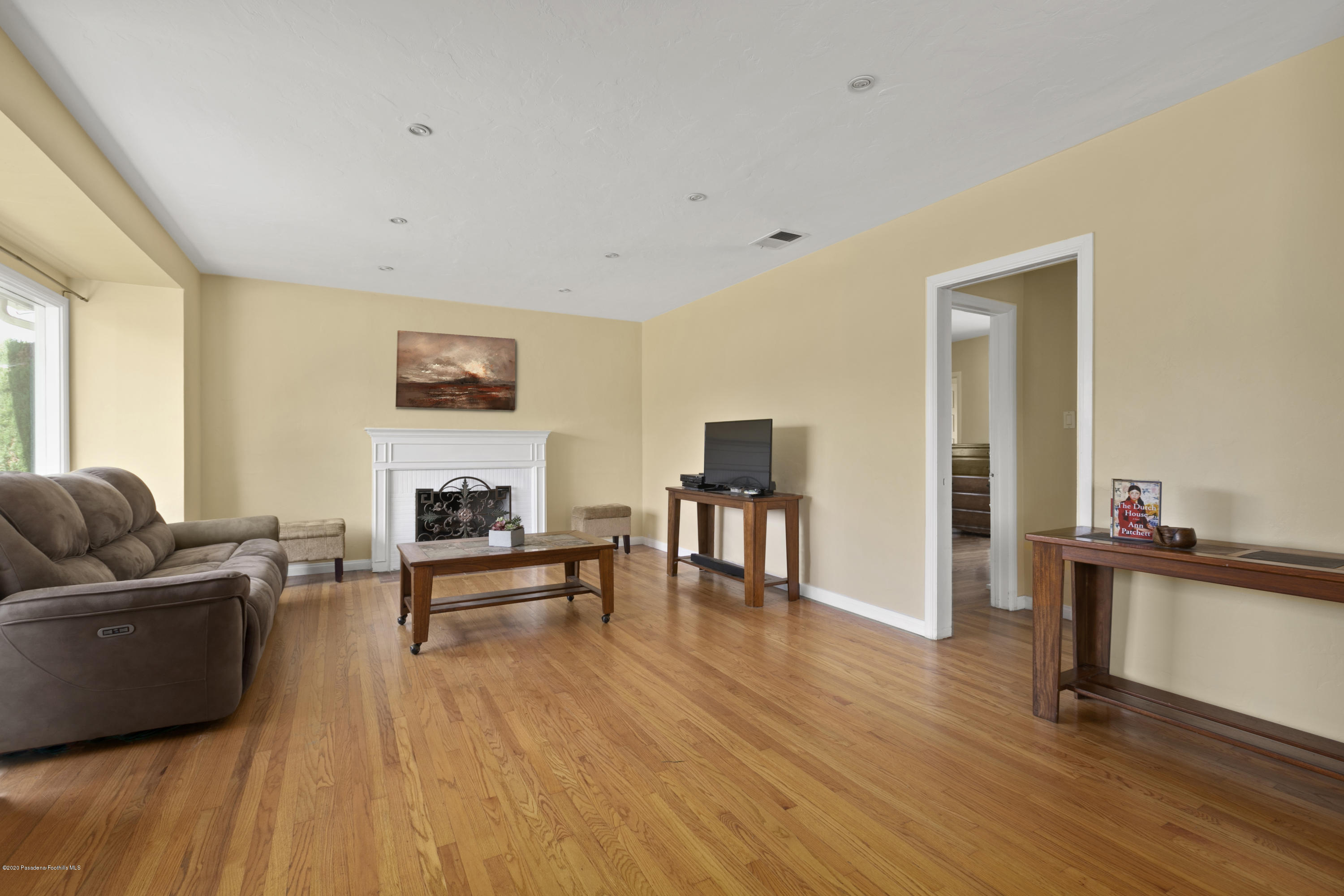 1231 Meadowbrook Road Altadena, CA 91001 - Photo 4 of 25 a living room with furniture and a wooden floor