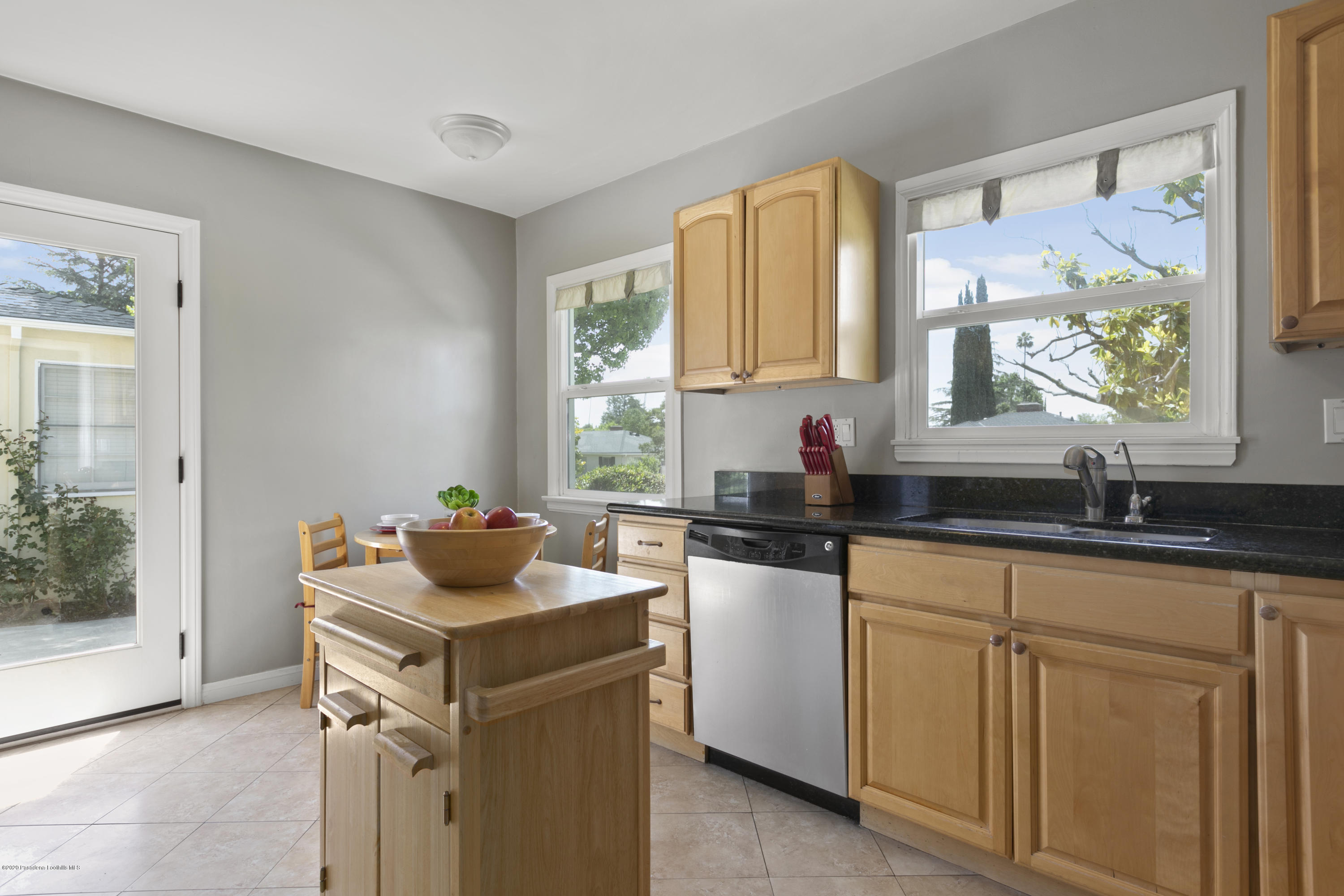 1231 Meadowbrook Road Altadena, CA 91001 - Photo 10 of 25 a kitchen with sink cabinets and window