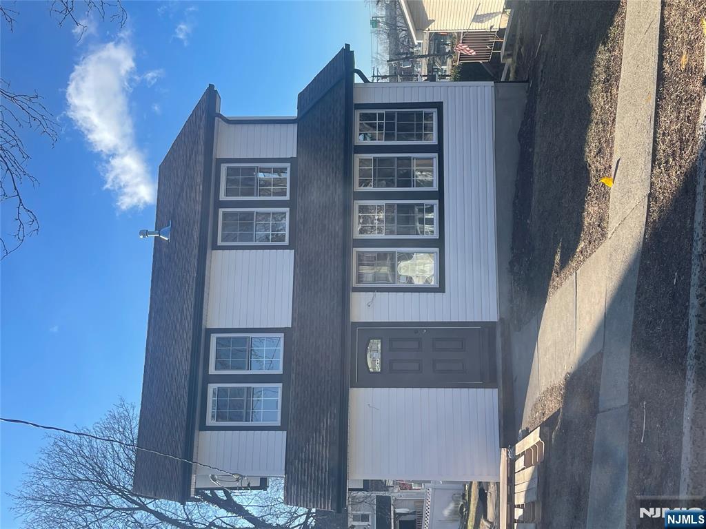 38 Chestnut Avenue Bogota, NJ 07603 - Photo 1 of 1 a front view of a house with yard