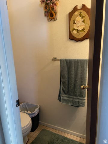3977 Rivendell Road, Unit AB Taylorsville, UT 84129 - Photo 11 of 14 Bathroom with baseboards and light tile patterned floors