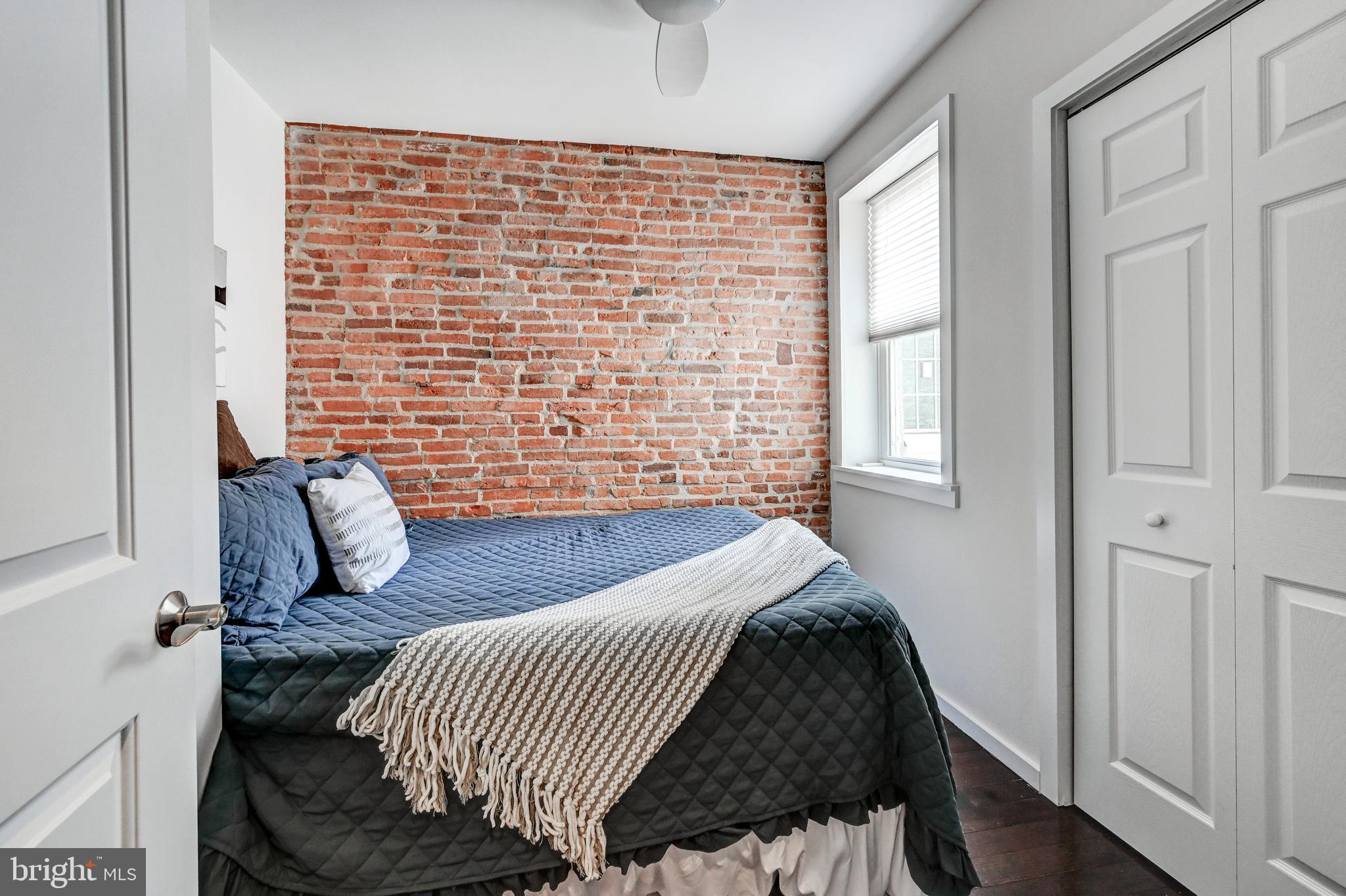 136 West Ostend Street Baltimore, MD 21230 - Photo 18 of 33 a bedroom with a bed and a window