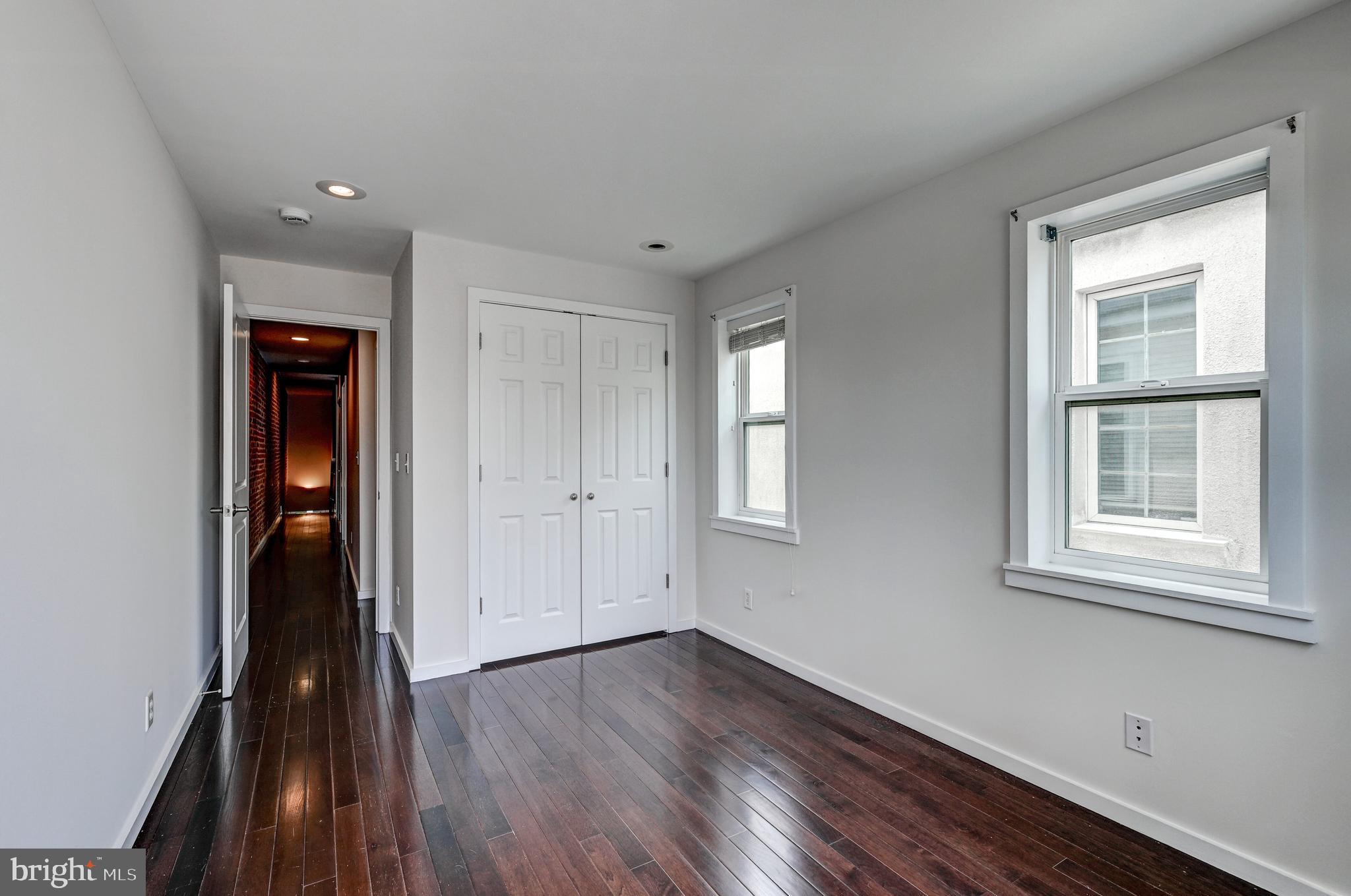 136 West Ostend Street Baltimore, MD 21230 - Photo 20 of 33 wooden floor in an empty room with a window