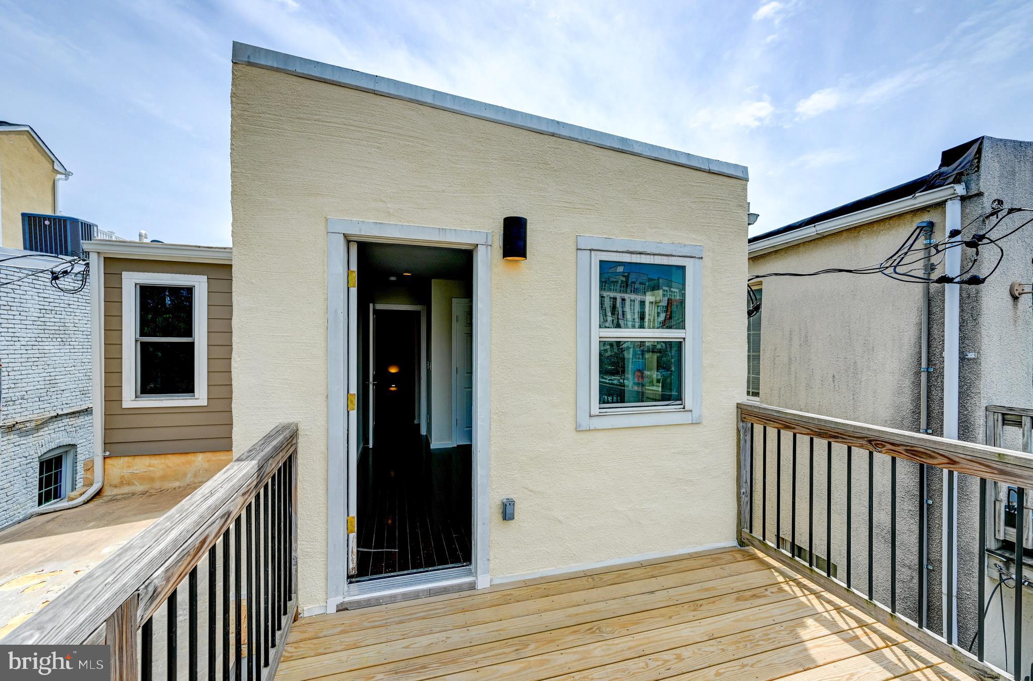 136 West Ostend Street Baltimore, MD 21230 - Photo 24 of 33 a view of a house with a wooden deck