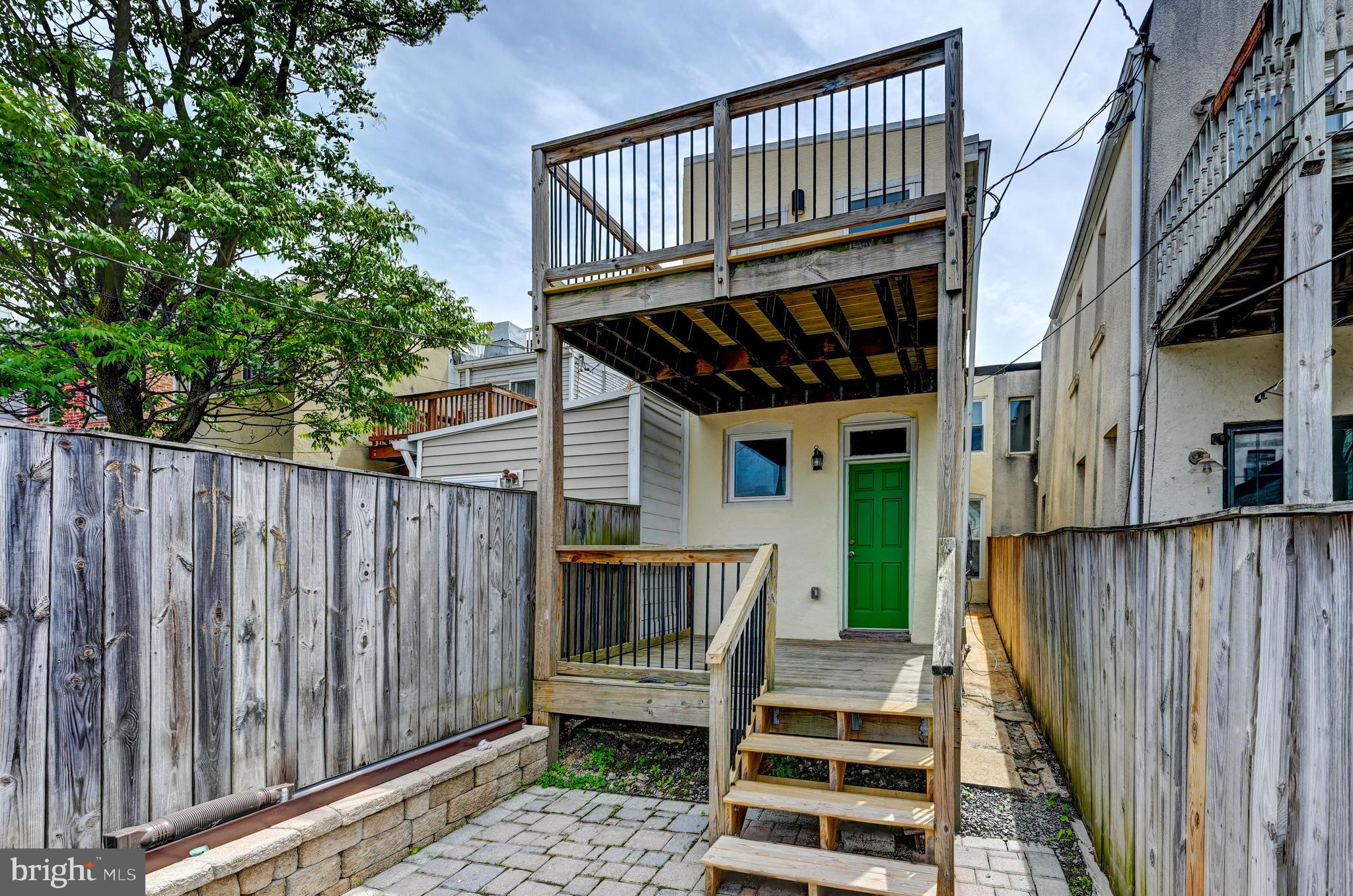 136 West Ostend Street Baltimore, MD 21230 - Photo 27 of 33 a view of a deck with wooden floor and fence