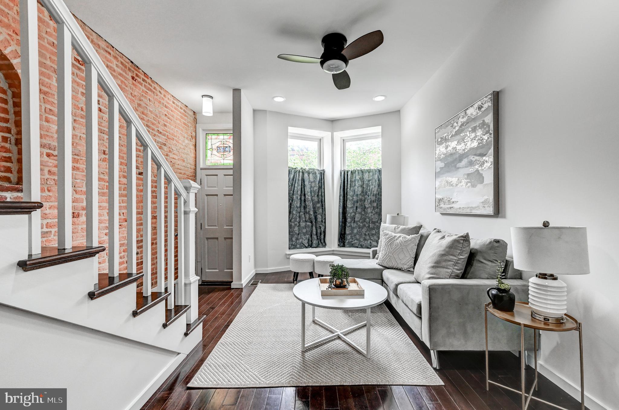 136 West Ostend Street Baltimore, MD 21230 - Photo 5 of 33 a living room with furniture and a large window