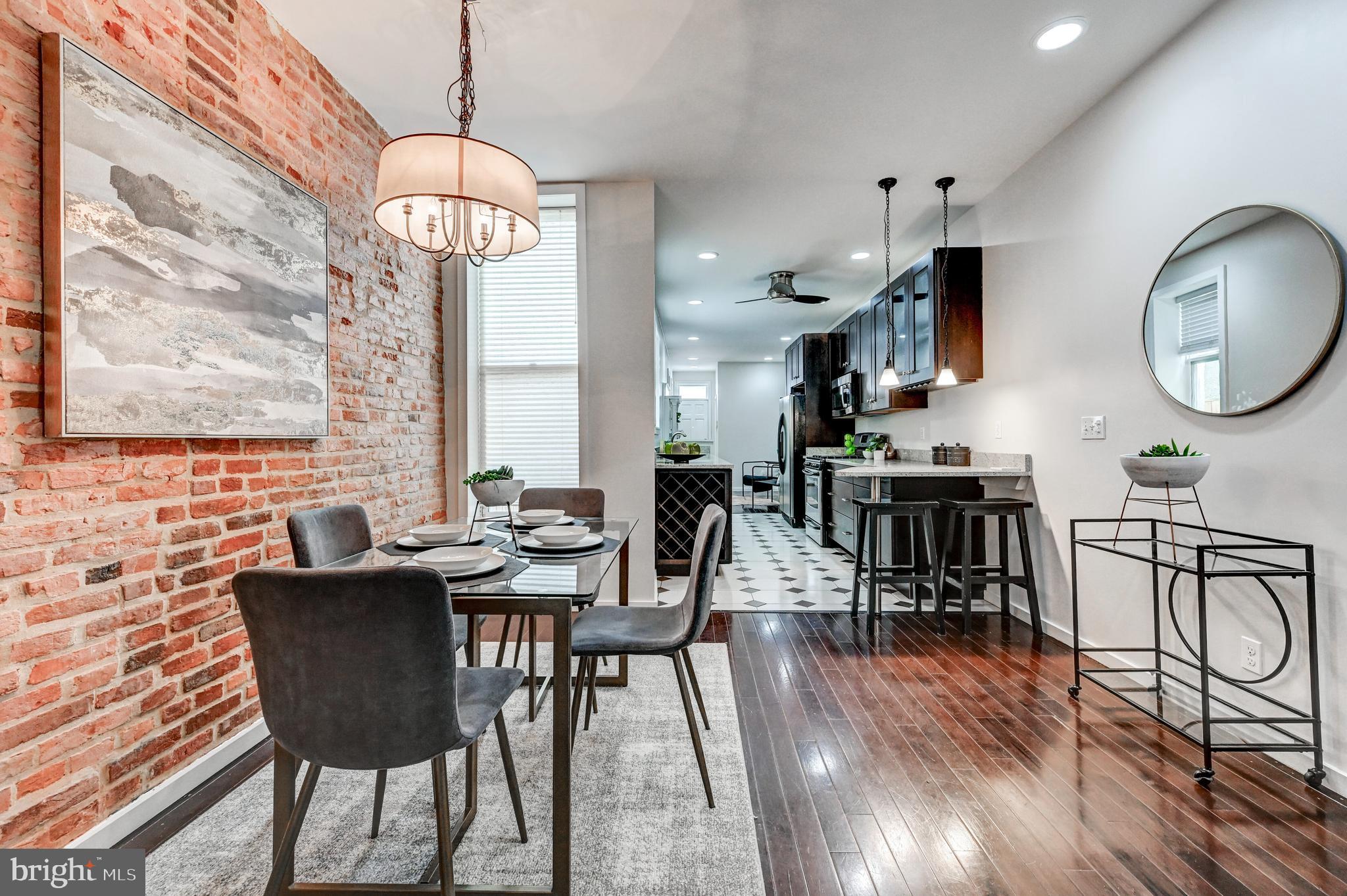 136 West Ostend Street Baltimore, MD 21230 - Photo 6 of 33 a view of a dining room with furniture window and wooden floor