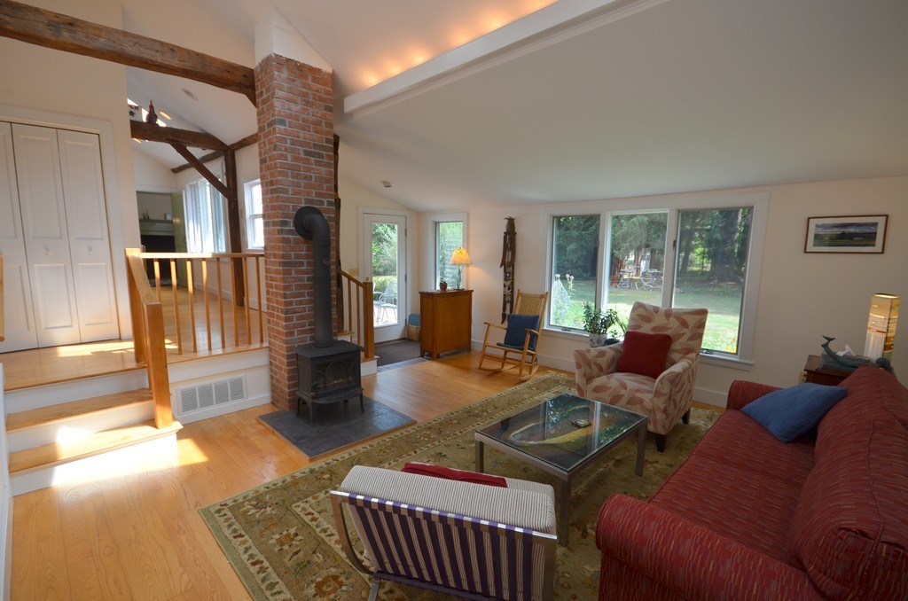 713 Bay Road Amherst, MA 01002 - Photo 2 of 29 a living room with furniture and a fireplace