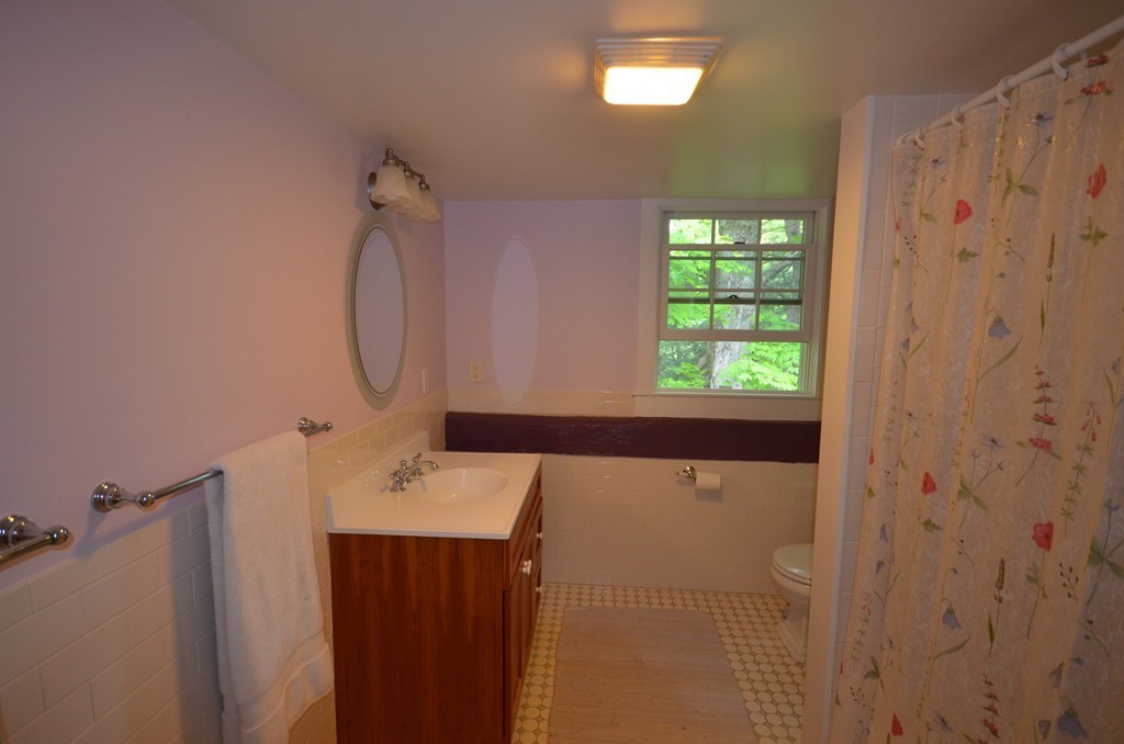 713 Bay Road Amherst, MA 01002 - Photo 22 of 29 a bathroom with a bathtub and shower