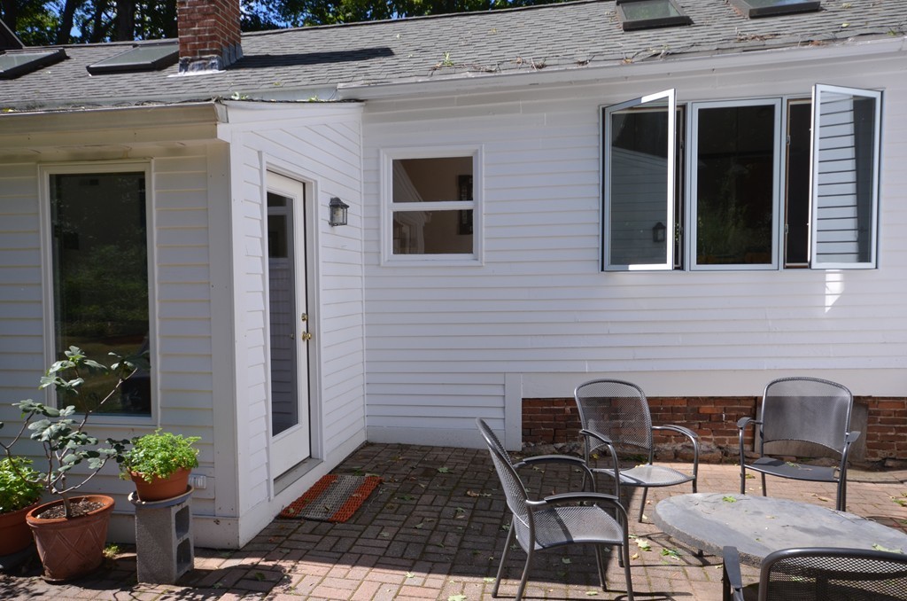 713 Bay Road Amherst, MA 01002 - Photo 25 of 29 a front view of a house with outdoor seating