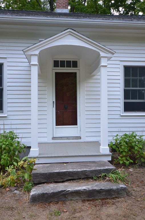 713 Bay Road Amherst, MA 01002 - Photo 27 of 29 a front view of a house with a yard