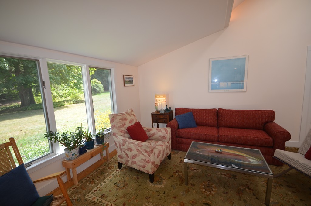 713 Bay Road Amherst, MA 01002 - Photo 4 of 29 a living room with furniture and a large window