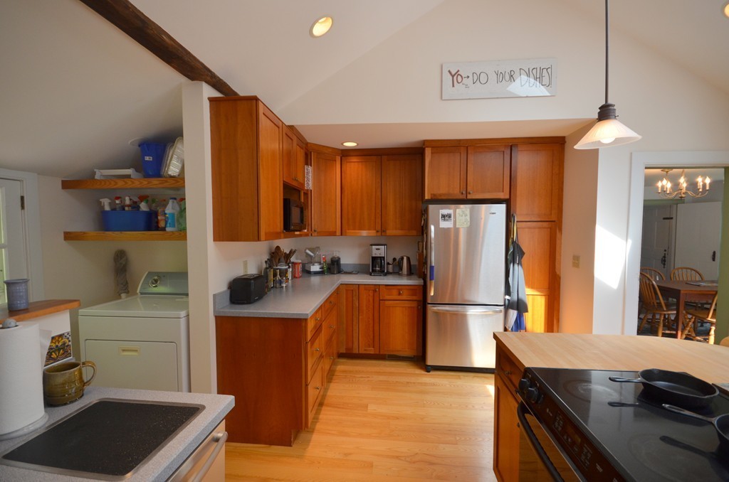 713 Bay Road Amherst, MA 01002 - Photo 10 of 29 a kitchen with a sink appliances and cabinets