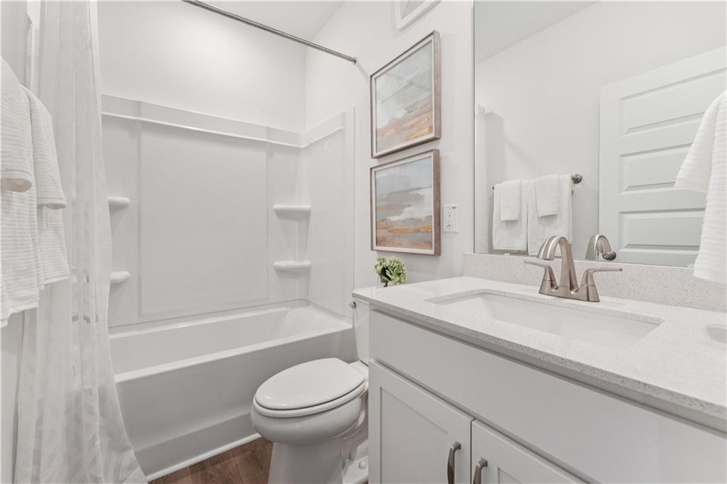 314 Skylar Court Southeast, Unit 93 Atlanta, GA 30312 - Photo 20 of 26 a bathroom with a sink a toilet and a bathtub