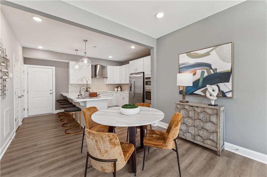 314 Skylar Court Southeast, Unit 93 Atlanta, GA 30312 - Photo 5 of 26 a view of a dining room with furniture and wooden floor