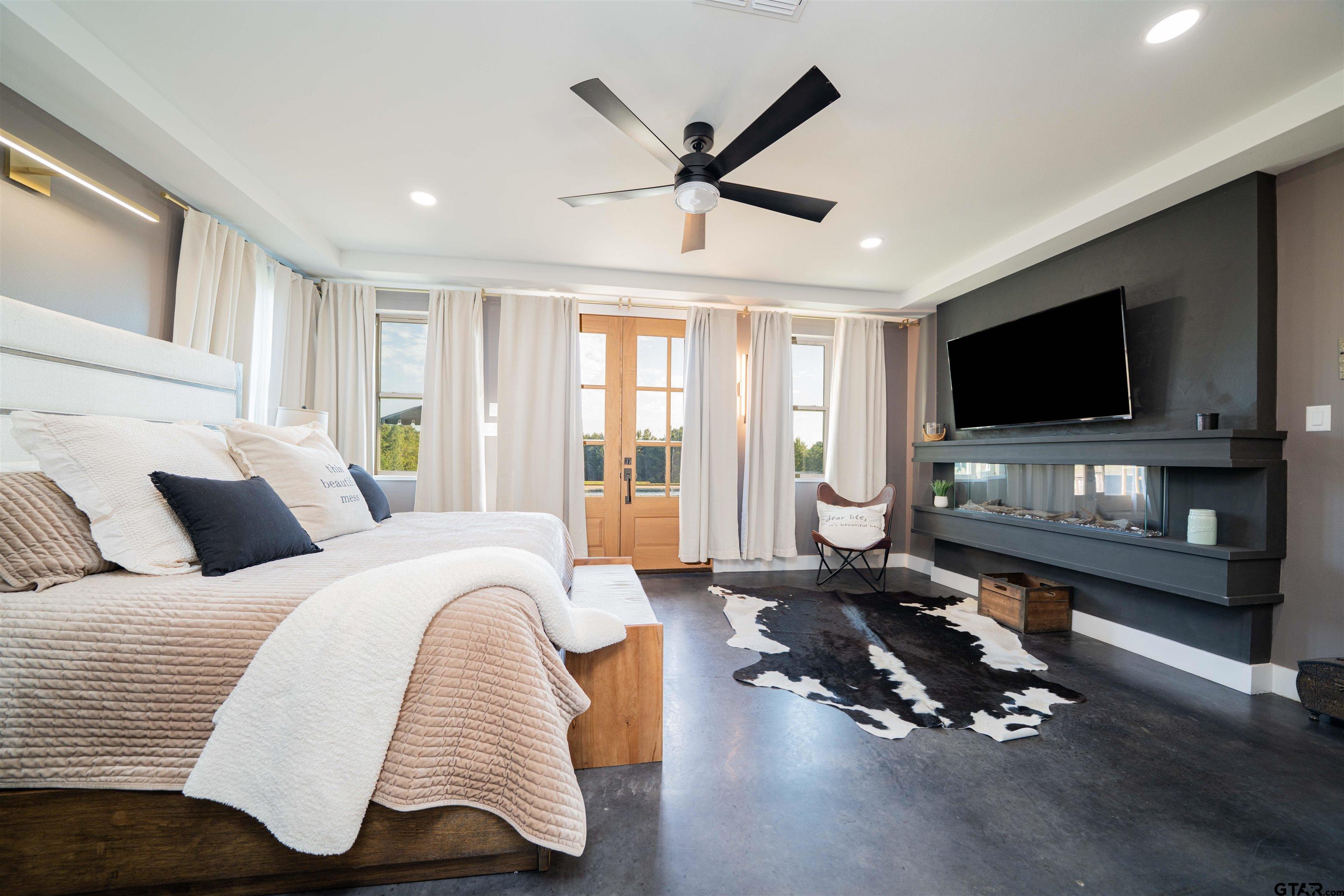 1258 Fire Tower Road Hallsville, TX 75650 - Photo 11 of 45 a bedroom with furniture and a flat screen tv