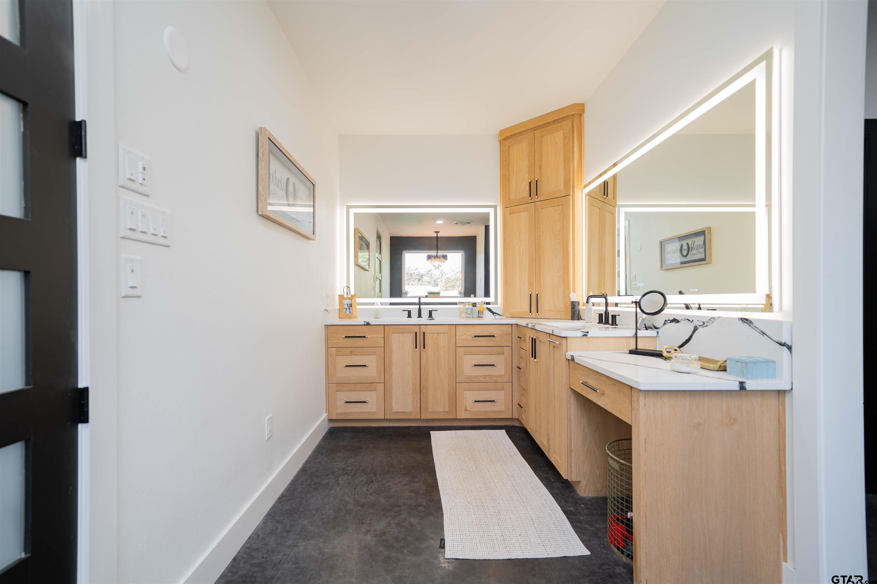 1258 Fire Tower Road Hallsville, TX 75650 - Photo 12 of 45 a large bathroom with a double vanity sink a mirror and a bathtub