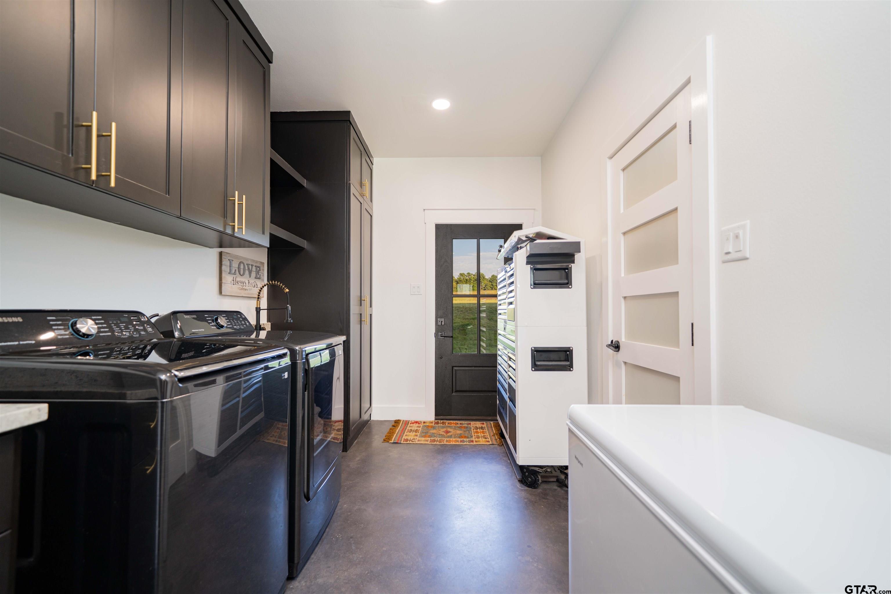 1258 Fire Tower Road Hallsville, TX 75650 - Photo 19 of 45 a kitchen with stainless steel appliances granite countertop a refrigerator and a stove