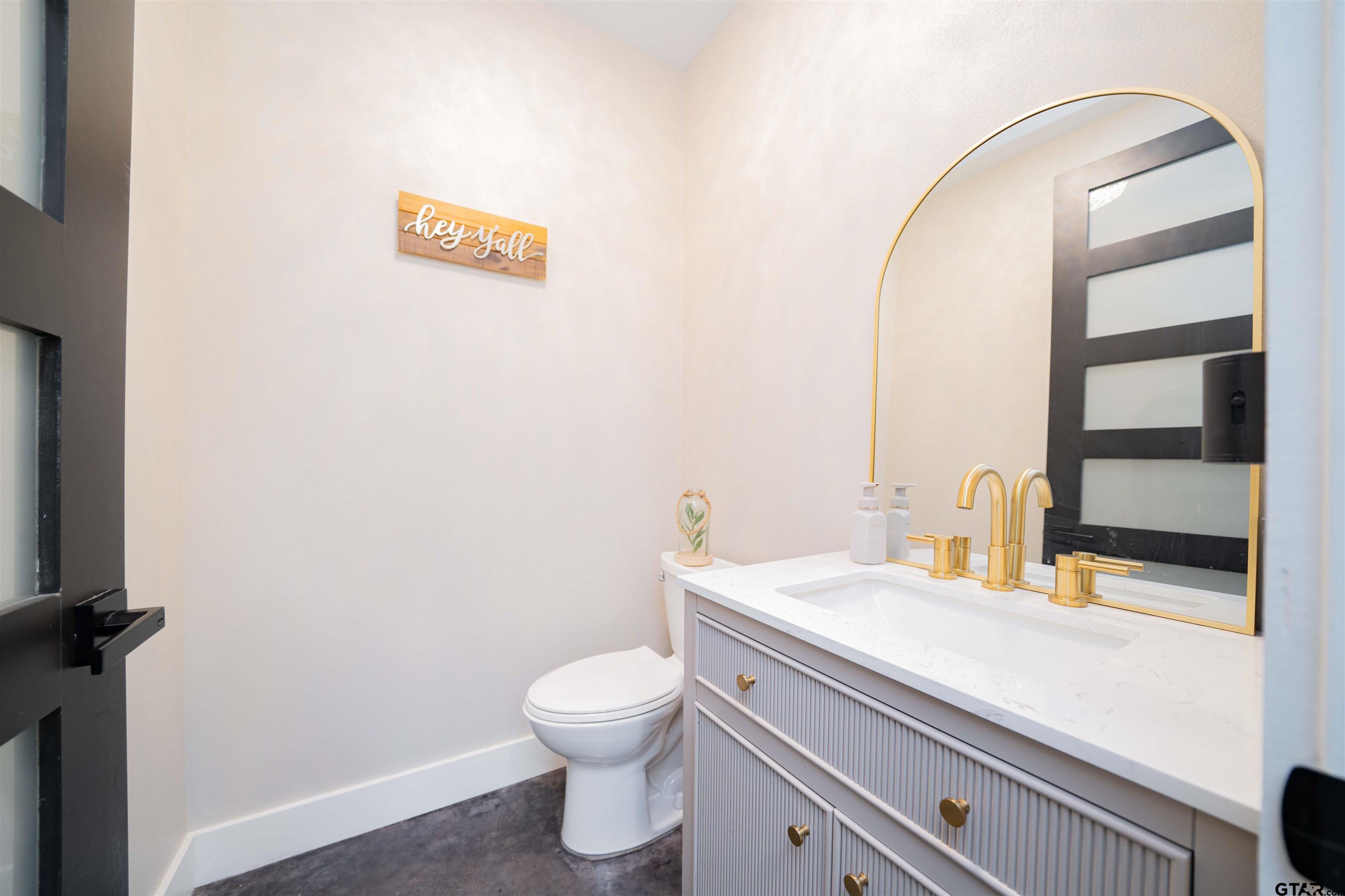 1258 Fire Tower Road Hallsville, TX 75650 - Photo 20 of 45 a bathroom with a sink and a toilet