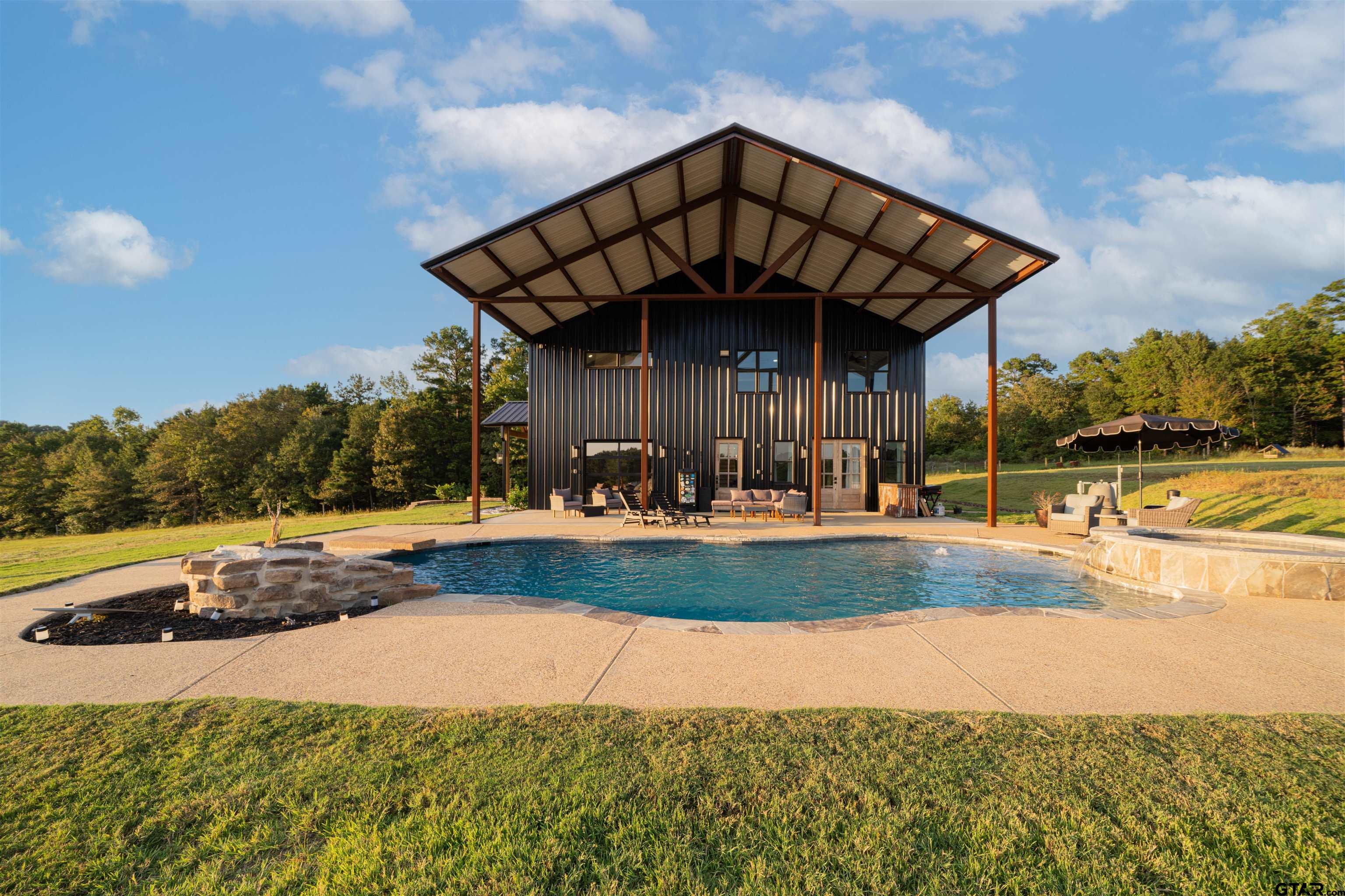 1258 Fire Tower Road Hallsville, TX 75650 - Photo 23 of 45 a view of a house with backyard and sitting area