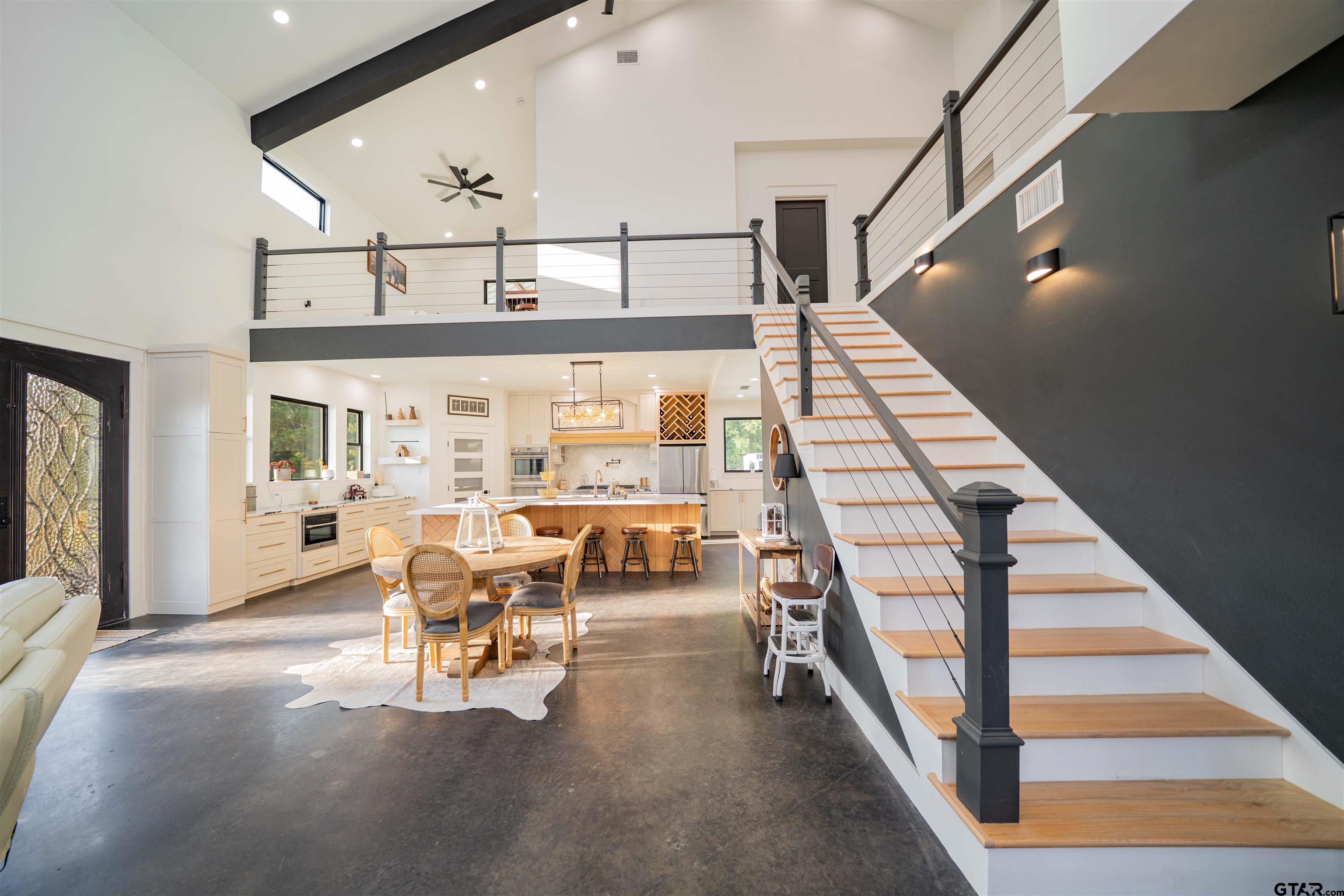 1258 Fire Tower Road Hallsville, TX 75650 - Photo 35 of 45 a view of a livingroom with furniture wooden floor and a floor to ceiling window
