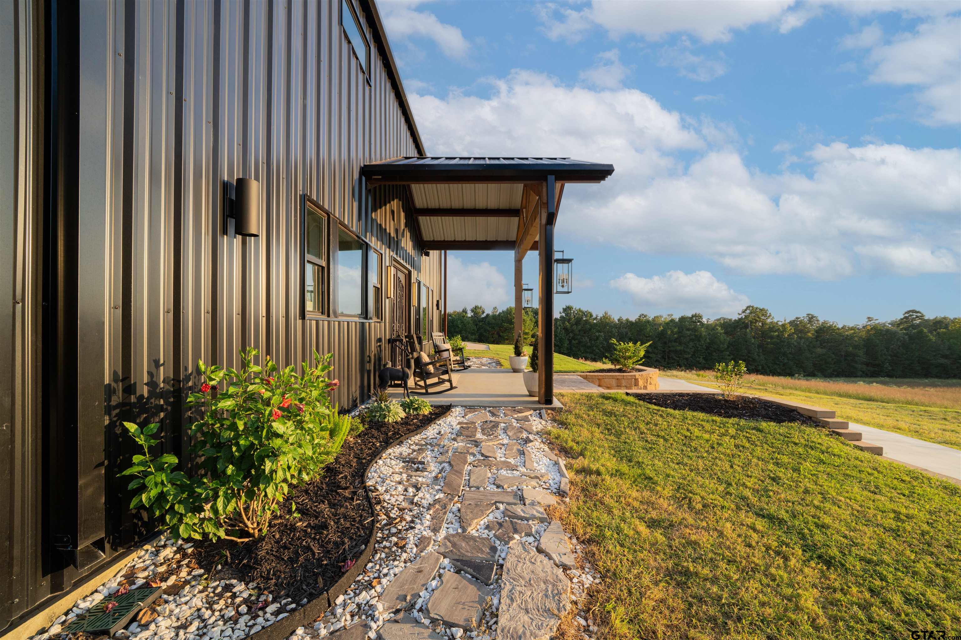 1258 Fire Tower Road Hallsville, TX 75650 - Photo 45 of 45 a house with swimming pool in front of it