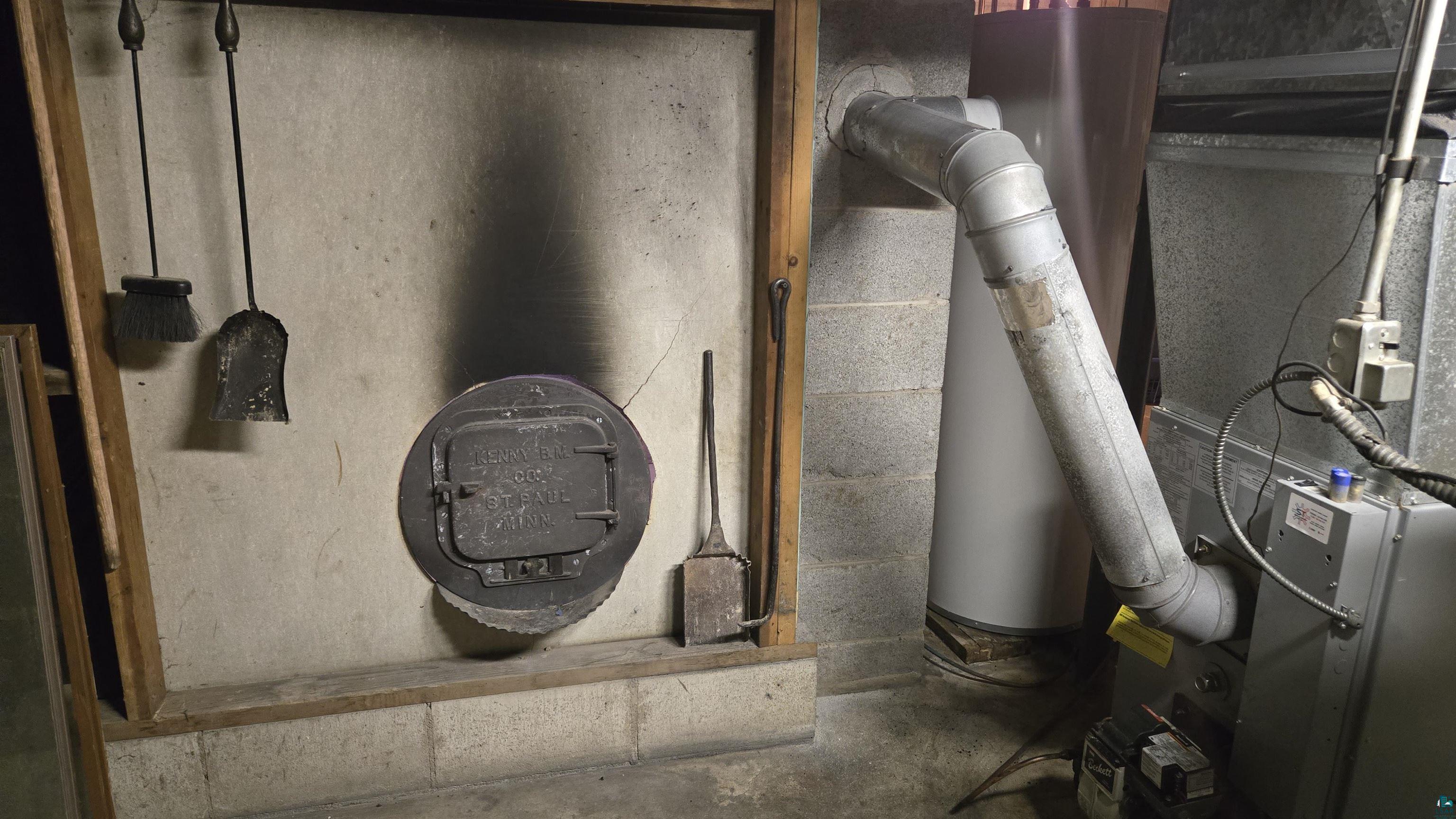 10614 Moose Lake Road Orr, MN 55771 - Photo 37 of 44 Basement utility area featuring a water heater, furnace unit, and ventilation ductwork