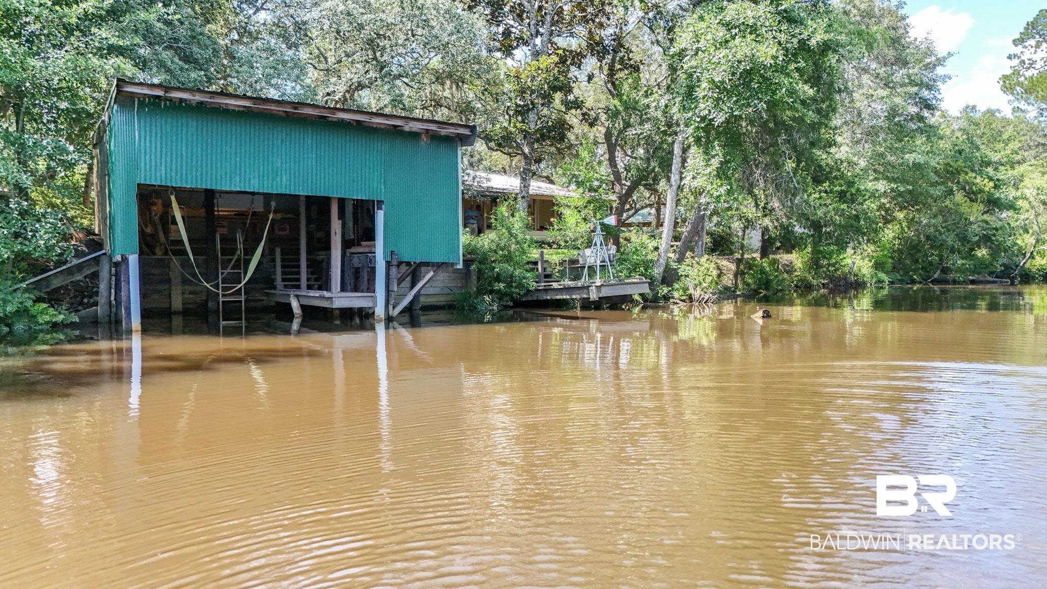 34341 Lost River Road Seminole, AL 36574 - Photo 33 of 36 Dock area with a water view and view of scattered trees