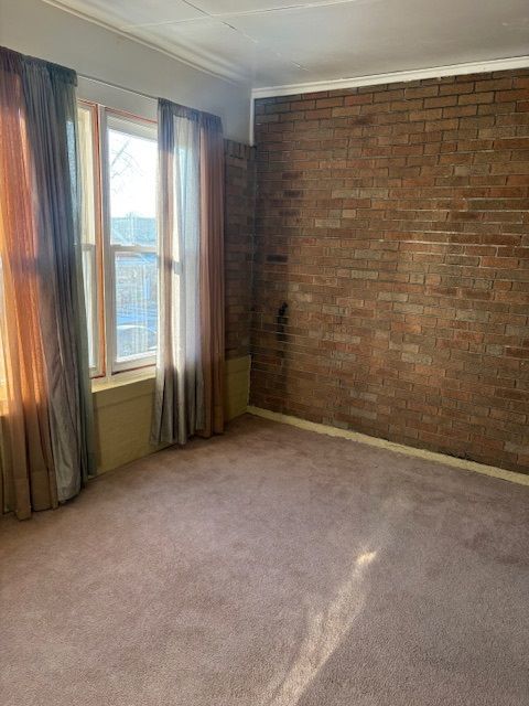 8400 South Honore Street, Unit 2 Chicago, IL 60620 - Photo 11 of 13 a view of an empty room with a window