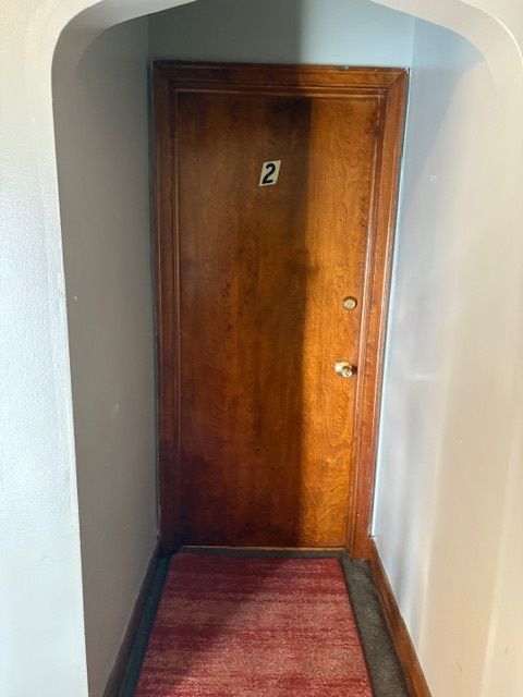 8400 South Honore Street, Unit 2 Chicago, IL 60620 - Photo 3 of 13 a view of a hallway with wooden floor