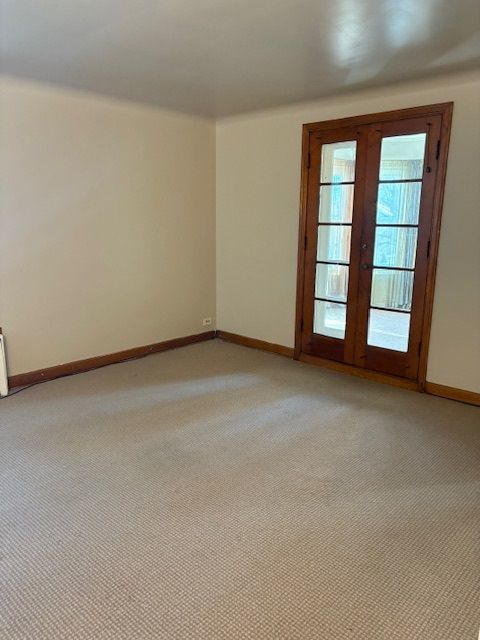 8400 South Honore Street, Unit 2 Chicago, IL 60620 - Photo 4 of 13 an empty room with windows