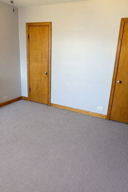 8400 South Honore Street, Unit 2 Chicago, IL 60620 - Photo 8 of 13 an empty room with closet